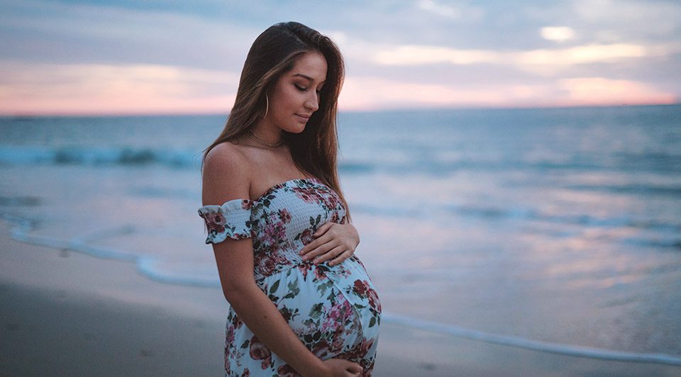 Pregnant Lady Embracing Belly Bump